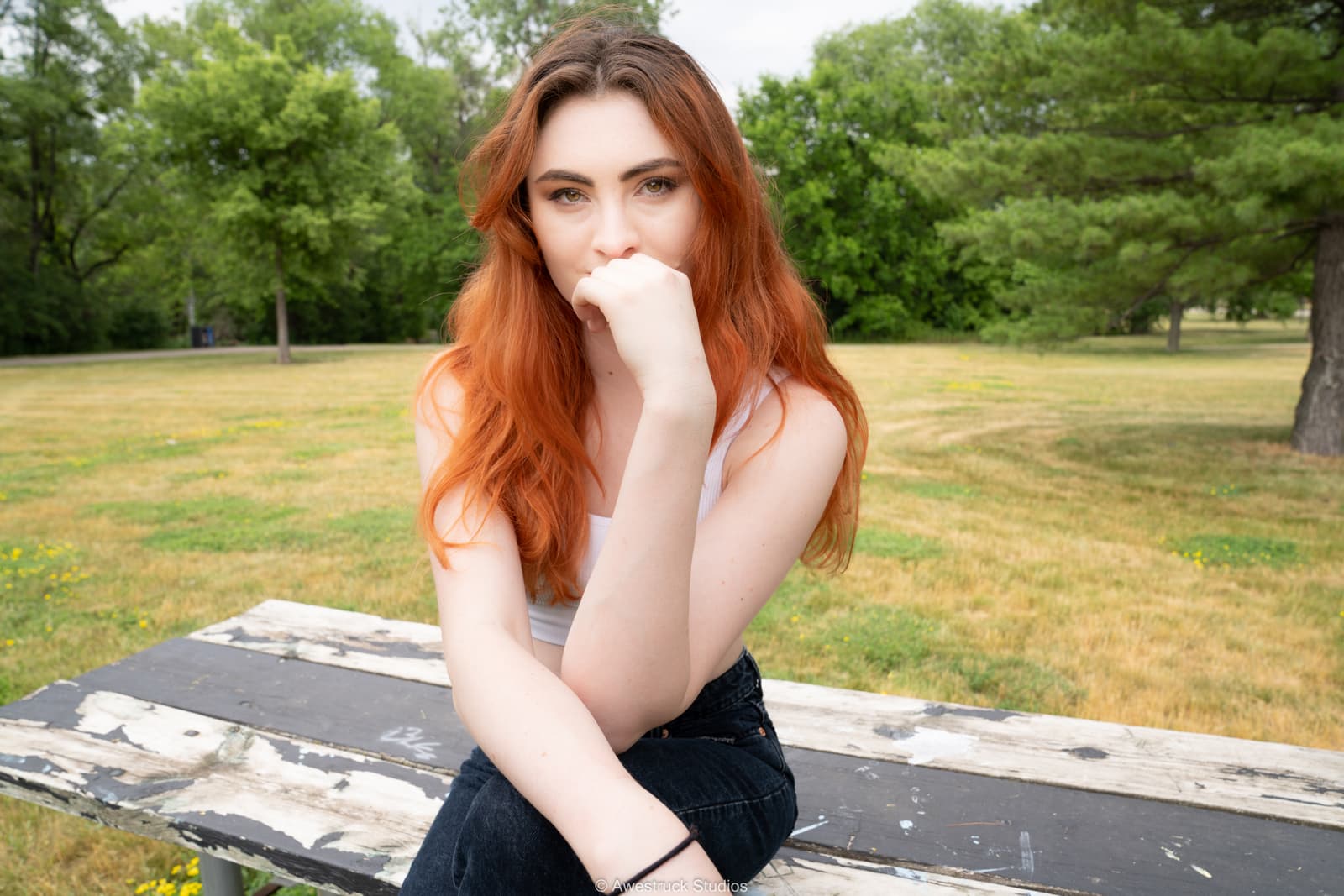 Cinematic portrait of a woman in a park.